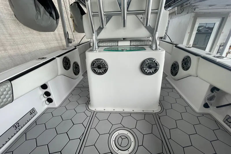Slide: The Image of 1998 Donzi 29 ZF Cuddy boat interior with hexagonal flooring and multiple speakers. - 35