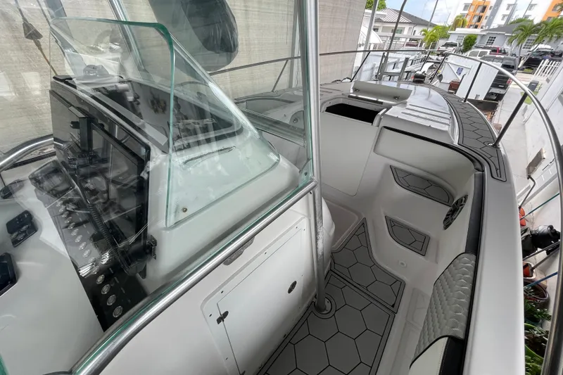Slide: The Image of 1998 Donzi 29 ZF Cuddy boat interior with modern dashboard and seating. - 43