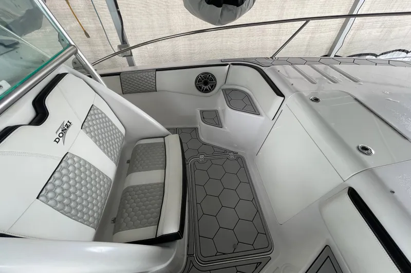Slide: The Image of Interior of a 1998 Donzi 29 ZF Cuddy boat with stylish seating and modern design. - 23
