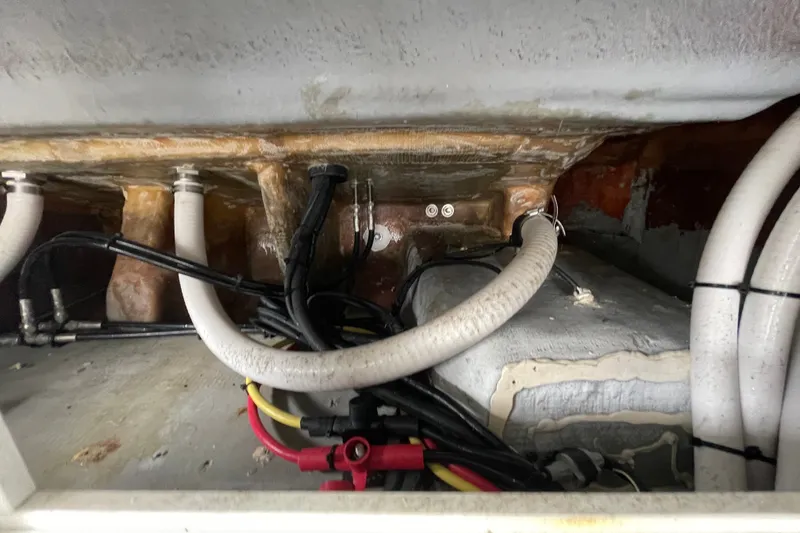 Slide: The Image of 1998 Donzi 29 ZF Cuddy boat interior wiring and plumbing details. - 54