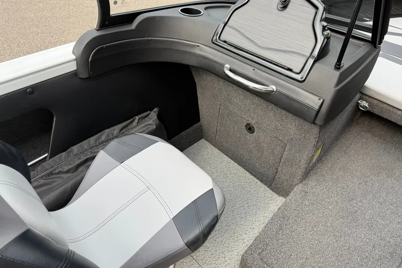 Slide: The Image of Interior of 2024 Crestliner 1850 Super Hawk boat, featuring seating and storage area. - 11