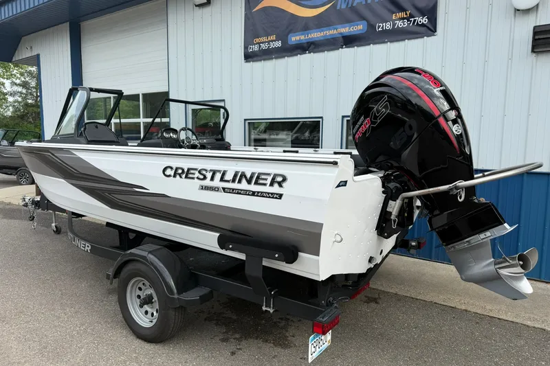 Slide: The Image of 2024 Crestliner 1850 Super Hawk boat with powerful outboard motor on trailer. - 3