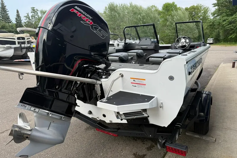 Slide: The Image of 2024 Crestliner 1850 Super Hawk boat with Mercury Pro XS engine, parked outdoors. - 4