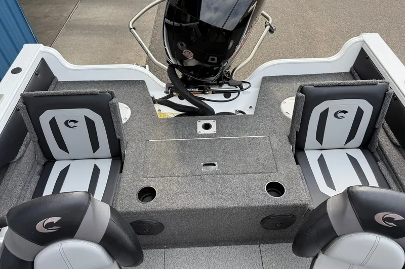 Slide: The Image of 2024 Crestliner 1850 Super Hawk boat interior with seating and motor view. - 12