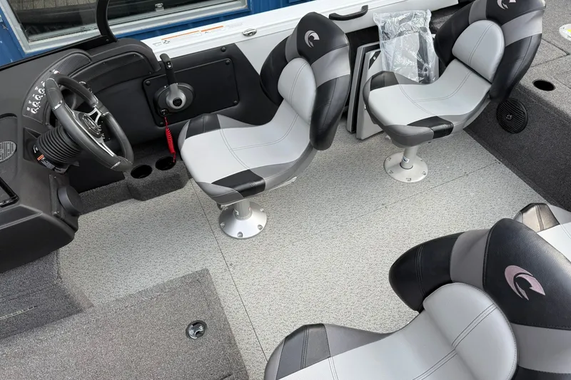 Slide: The Image of 2024 Crestliner 1850 Super Hawk interior with modern seating and steering console. - 9
