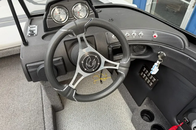 Slide: The Image of Steering wheel and dashboard of 2024 Crestliner 1850 Super Hawk boat. - 10
