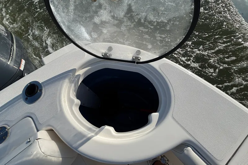 Slide: The Image of Open hatch on 2014 Robalo R300 Center Console boat, showing interior compartment. - 20