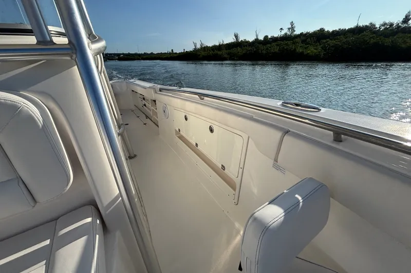 Slide: The Image of 2014 Robalo R300 Center Console boat interior with water view. - 14