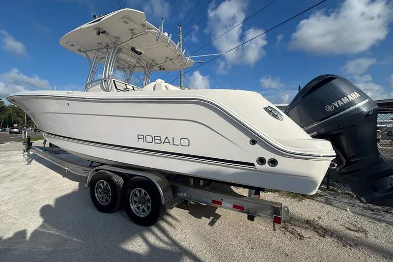 Slide: The Image of 2014 Robalo R300 Center Console boat on trailer with Yamaha engine. - 32