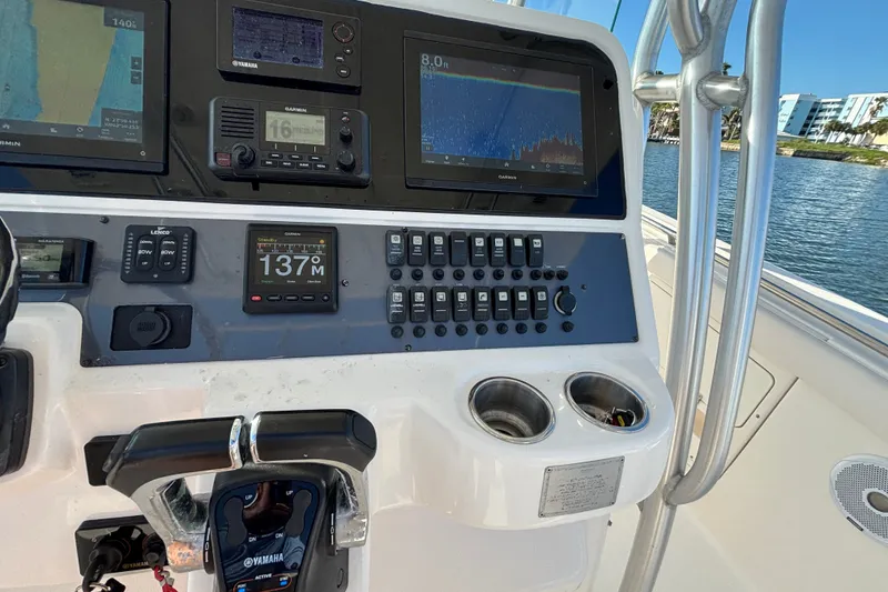 Slide: The Image of 2014 Robalo R300 Center Console dashboard with navigation and control systems. - 8