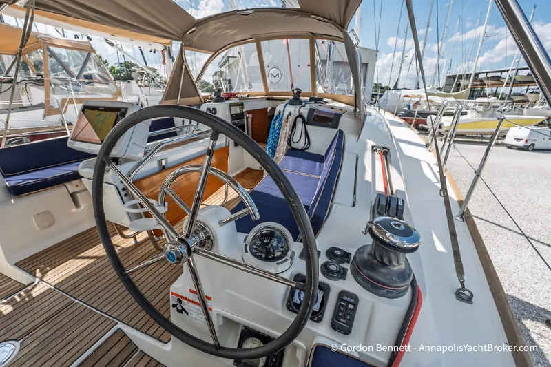 Slide: The Image of 2016 Jeanneau Sun Odyssey 439 yacht cockpit with steering wheel and navigation equipment. - 27