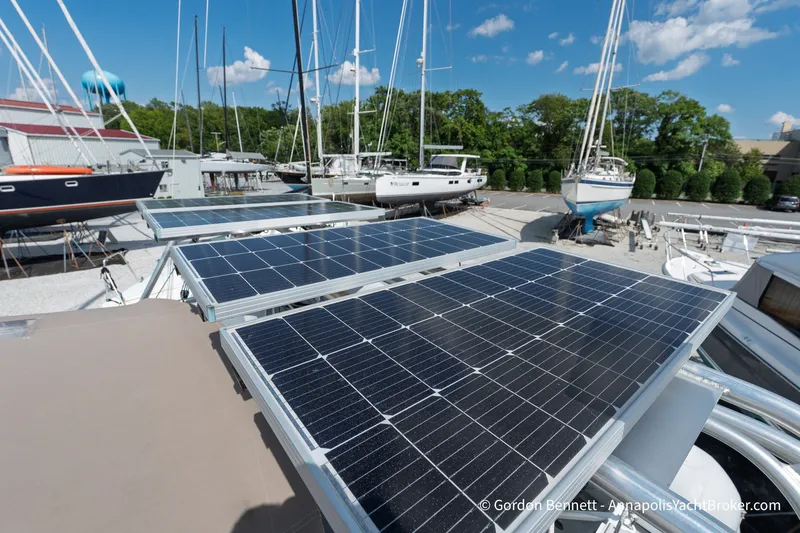 Slide: The Image of Solar panels on a 2016 Jeanneau Sun Odyssey 439 yacht in a marina setting. - 36