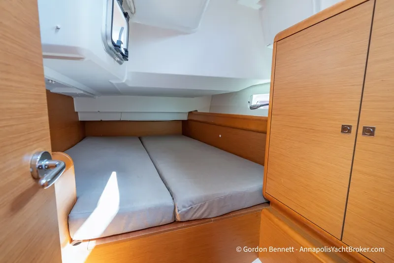 Slide: The Image of Cozy cabin interior of 2016 Jeanneau Sun Odyssey 439 yacht with wooden finish. - 61