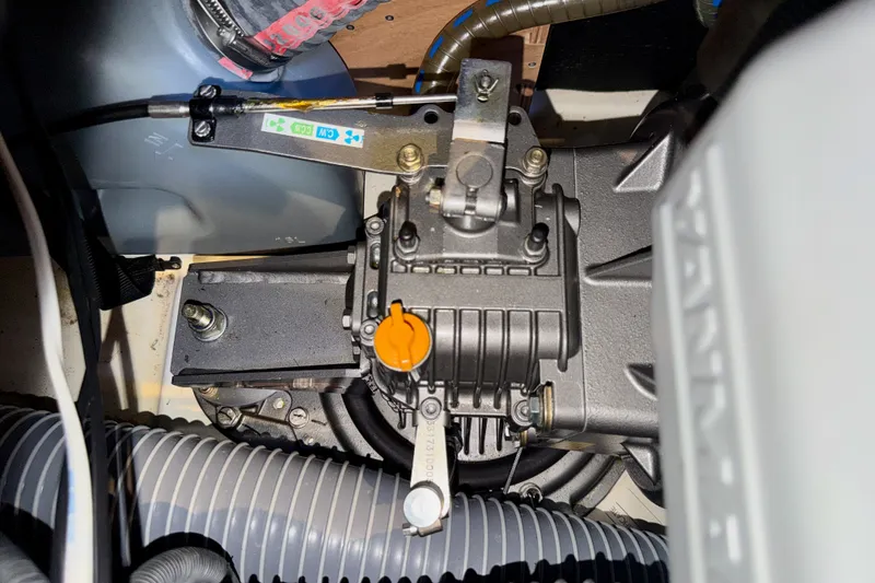 Slide: The Image of Engine compartment of a 2016 Jeanneau Sun Odyssey 439 sailboat, showcasing mechanical components. - 83