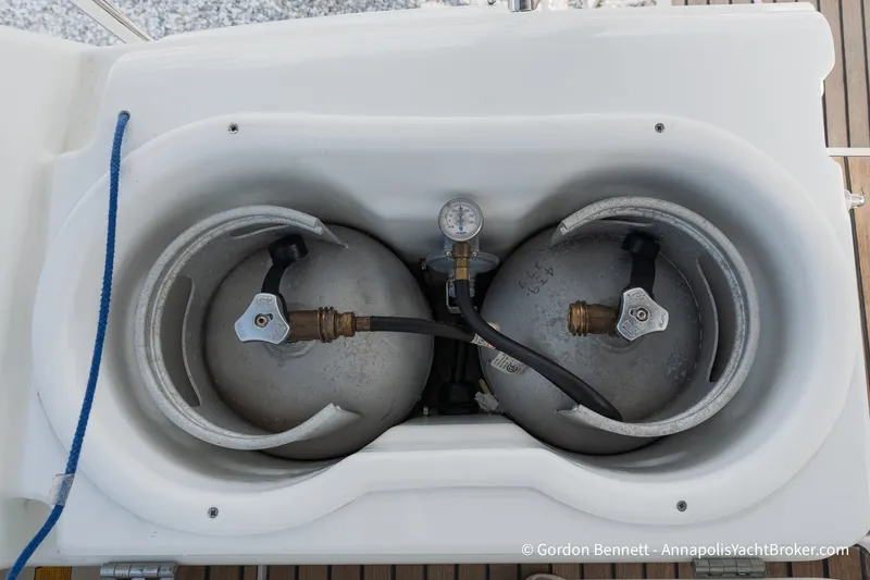 Slide: The Image of Propane tanks in Jeanneau Sun Odyssey 439 yacht, 2016 model, secured in storage compartment. - 80