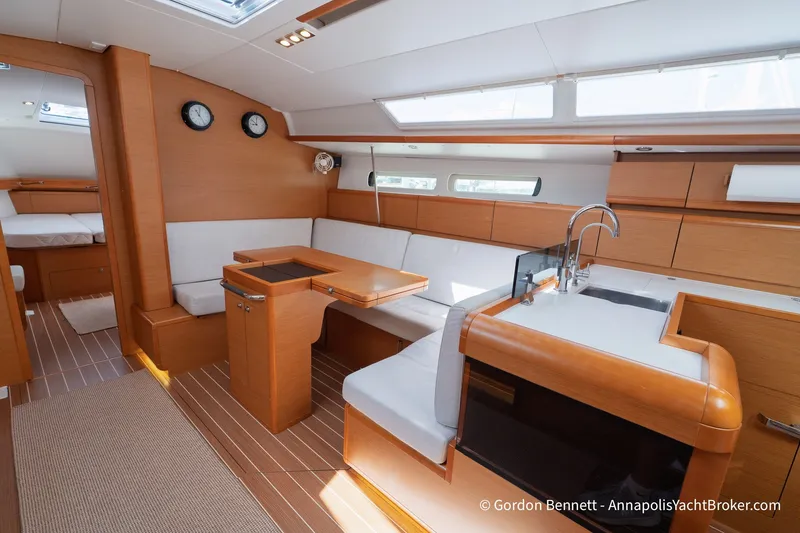 Slide: The Image of Interior of 2016 Jeanneau Sun Odyssey 439 yacht, featuring modern wood finish and spacious seating. - 51