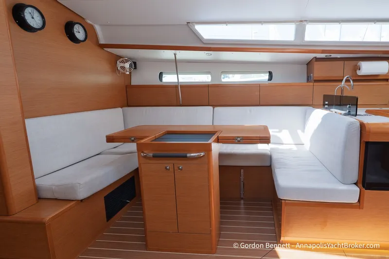 Slide: The Image of Interior of 2016 Jeanneau Sun Odyssey 439 yacht with cozy seating and wooden finishes. - 53