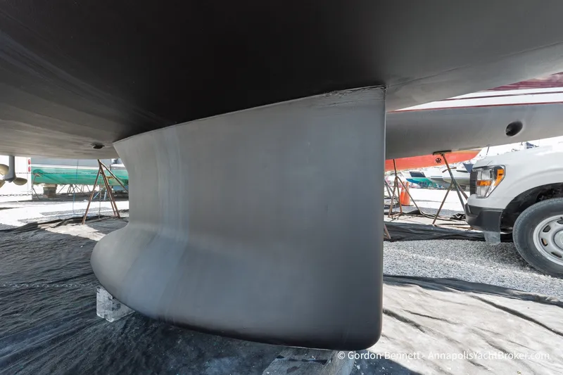 Slide: The Image of 2016 Jeanneau Sun Odyssey 439 keel in dry dock, showcasing sleek design and craftsmanship. - 45