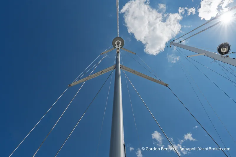 Slide: The Image of Mast of 2016 Jeanneau Sun Odyssey 439 sailboat against blue sky and clouds. - 19