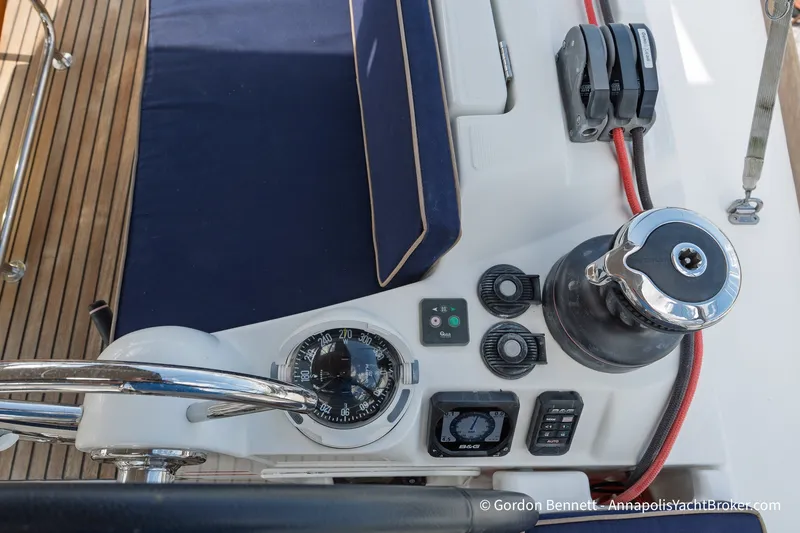 Slide: The Image of Cockpit controls of 2016 Jeanneau Sun Odyssey 439 sailboat with compass and winch. - 33