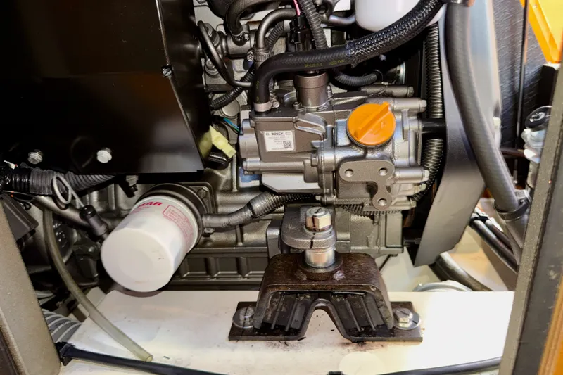 Slide: The Image of Engine compartment of a 2016 Jeanneau Sun Odyssey 439 sailboat, showcasing mechanical components. - 82