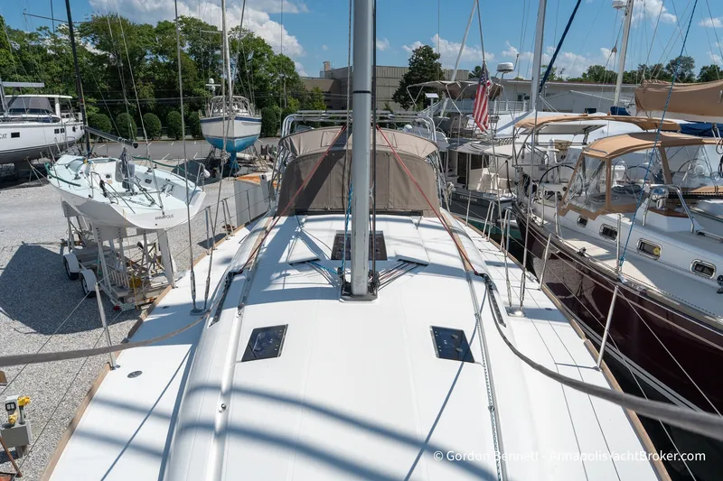Slide: The Image of 2016 Jeanneau Sun Odyssey 439 sailboat docked among other yachts in a marina. - 18