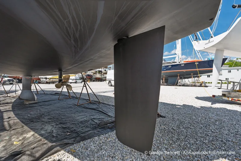 Slide: The Image of 2016 Jeanneau Sun Odyssey 439 sailboat keel and propeller in a boatyard. - 46
