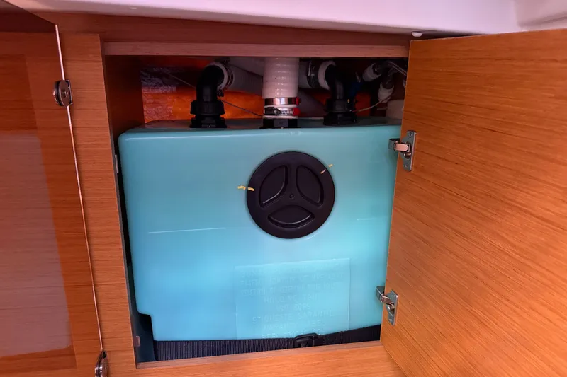 Slide: The Image of Water tank inside Jeanneau Sun Odyssey 439 yacht, 2016 model, with wooden cabinet. - 75