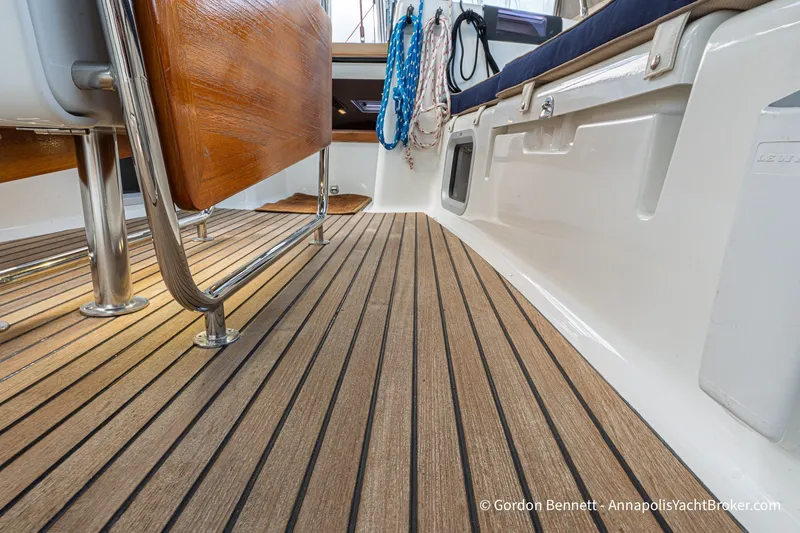 Slide: The Image of Teak deck of 2016 Jeanneau Sun Odyssey 439 yacht with seating and ropes. - 38