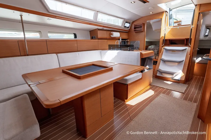 Slide: The Image of Interior of 2016 Jeanneau Sun Odyssey 439 yacht with elegant wood finish and spacious seating. - 54