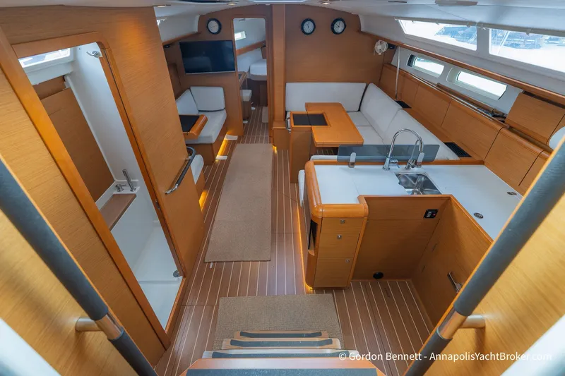 Slide: The Image of Interior of 2016 Jeanneau Sun Odyssey 439 yacht, featuring modern kitchen and seating area. - 47