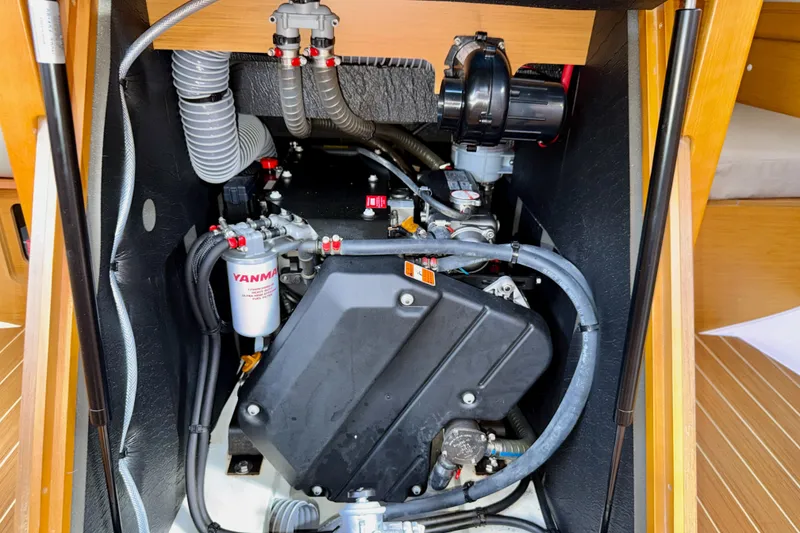Slide: The Image of Engine compartment of a 2016 Jeanneau Sun Odyssey 439 sailboat, featuring Yanmar components. - 81