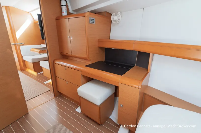 Slide: The Image of Interior of 2016 Jeanneau Sun Odyssey 439 yacht with wooden cabinetry and seating area. - 59