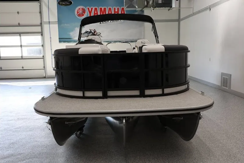 Slide: The Image of 2026 South Bay LE 224 pontoon boat in a garage, front view. - 6