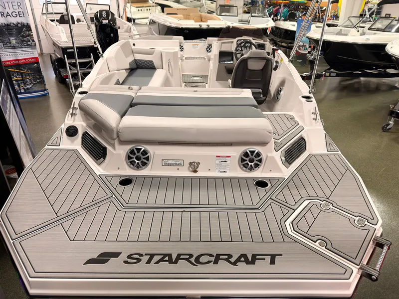 Slide: The Image of The image shows a 2027 Starcraft 211SVXIO boat with gray upholstery and a modern design. - 4