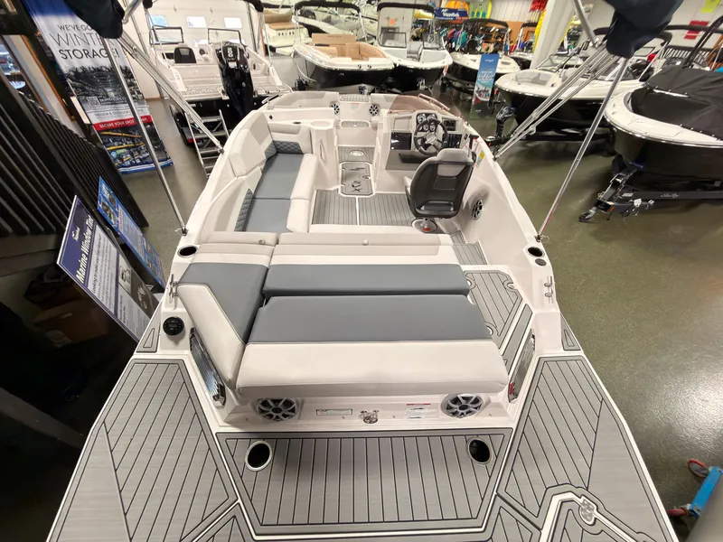 Slide: The Image of The image shows a 2027 Starcraft 211SVXIO boat with gray upholstery and a modern cockpit. - 5