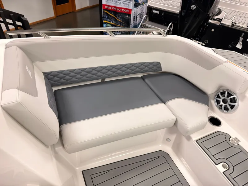 Slide: The Image of The image shows a modern boat seat with gray and white upholstery and a speaker. - 36
