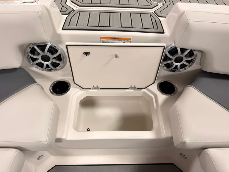 Slide: The Image of The image shows the interior of a Starcraft 211SVXIO boat with speakers and cup holders. - 39