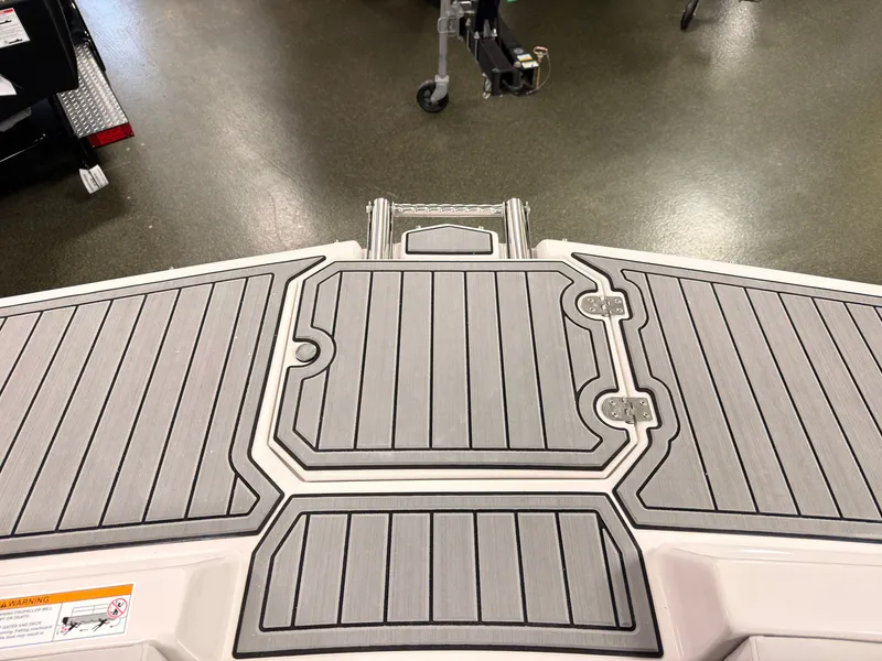 Slide: The Image of The image shows the gray deck of a Starcraft 211SVXIO boat with textured patterns. - 42