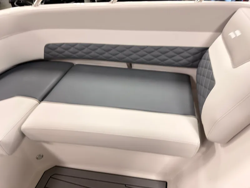 Slide: The Image of The image shows a sleek gray and white bench seat in a boat. - 40