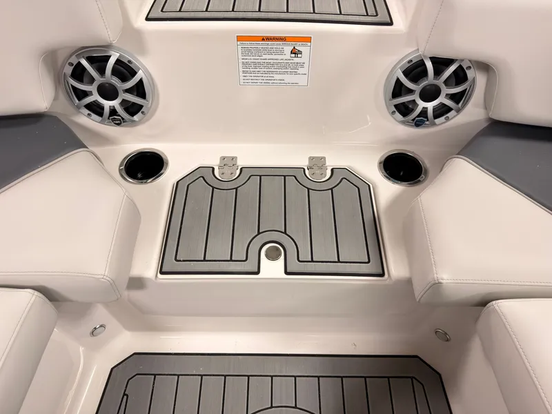 Slide: The Image of The image shows the interior of a Starcraft 211SVXIO boat with speakers and cup holders. - 38