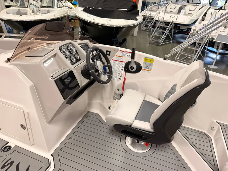 Slide: The Image of The image shows the cockpit of a 2027 Starcraft 211SVXIO boat with a modern helm. - 20