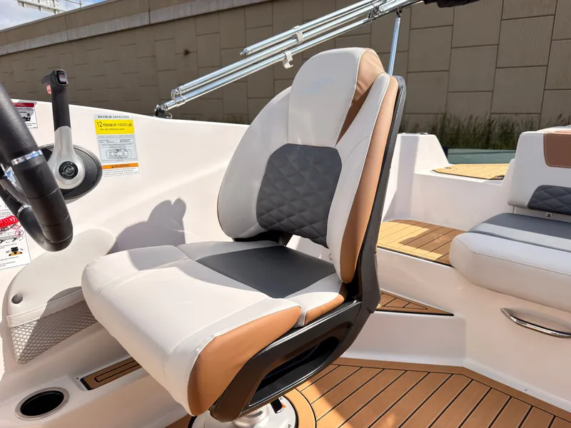 Slide: The Image of The 2027 Starcraft 211SVXIO features a modern seat with white and brown upholstery. - 37