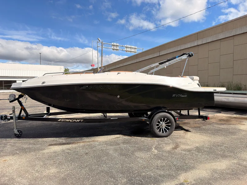 Slide: The Image of A 2027 Starcraft 211SVXIO boat on a trailer. It features a sleek design. - 4