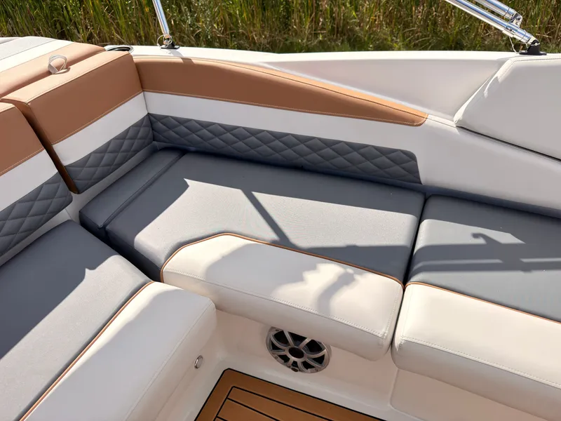 Slide: The Image of The 2027 Starcraft 211SVXIO features a stylish seating area with cushioned seats and elegant detailing. - 31