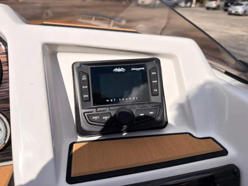 Slide: The Image of A modern audio system is integrated into the dashboard of a 2027 Starcraft 211SVXIO. - 41