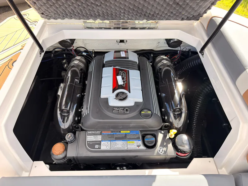 Slide: The Image of The engine compartment of a 2027 Starcraft 211SVXIO features a powerful engine with clear details. - 25
