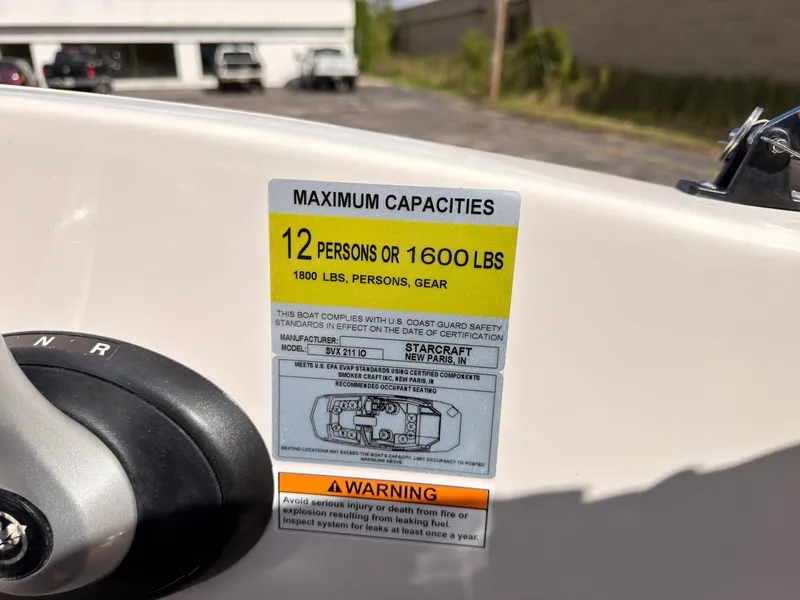 Slide: The Image of A sign on a boat shows the maximum capacity of 12 persons or 1600 pounds. - 45