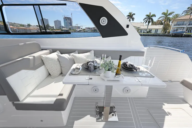 Slide: The Image of Luxurious interior of 2025 Valiatt 380 Bowrider yacht with elegant dining setup and waterfront view. - 14