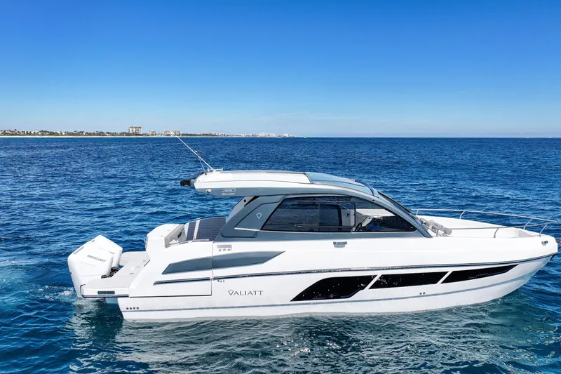 Slide: The Image of 2025 Valiatt 380 Bowrider cruising on open blue sea under clear sky. - 10